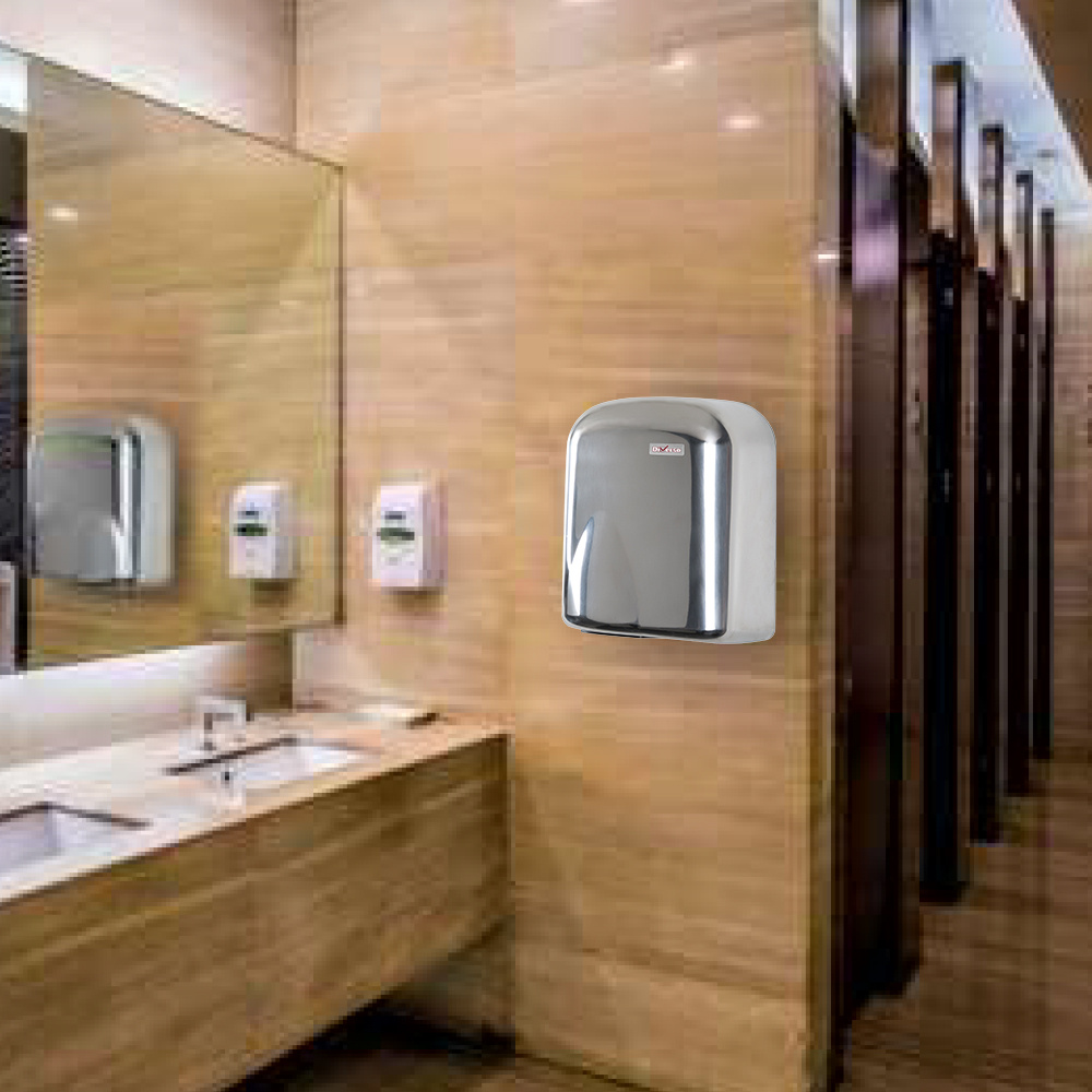 Wall-mounted automatic hand dryer on a wood-paneled restroom wall beside sinks and mirrors.